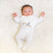 Side-snap onesie with stork embroidery, made from soft Prima Cotton