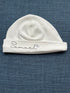 Custom name hat made from premium Prima cotton, displayed in a stylish neutral color with personalized embroidered text on the front.