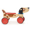 Mentari ride‑on puppy toy for toddlers, plush seat, wooden wheels, interactive push‑along ride‑on, supportive handle.