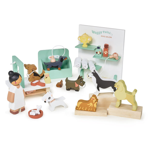 Wooden Waggy Tails dog salon set: groomer station, shampoo tub, hairdryer, brushes, trophies, and seven wooden dog breed figures.