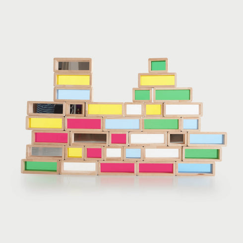 Rainbow Bricks – PK36: large and small rubberwood building bricks with transparent coloured acrylic inserts (red, green, blue, yellow, clear, mirror) for stacking, colour‑mixing and light-box sensory play