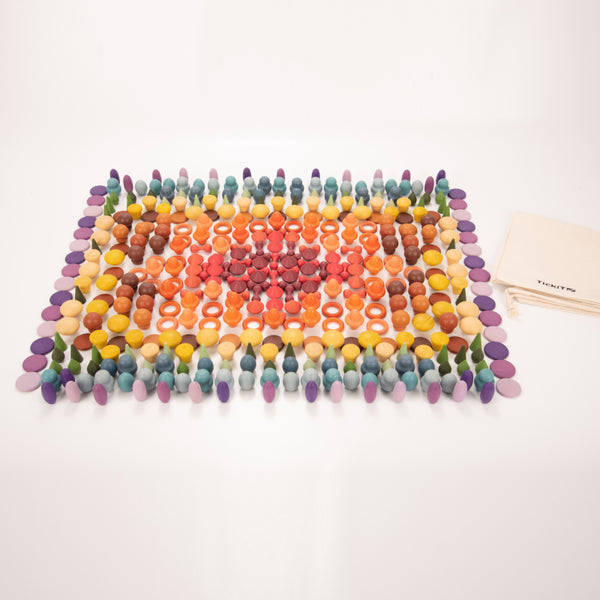 Wooden Treasures Super Set: smooth nature‑inspired wooden shapes in seven organic colour shades for imaginative play.