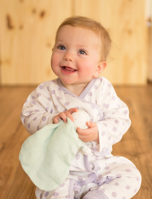 Lavender-dotted baby footie with side snaps, made from soft Prima Cotton
